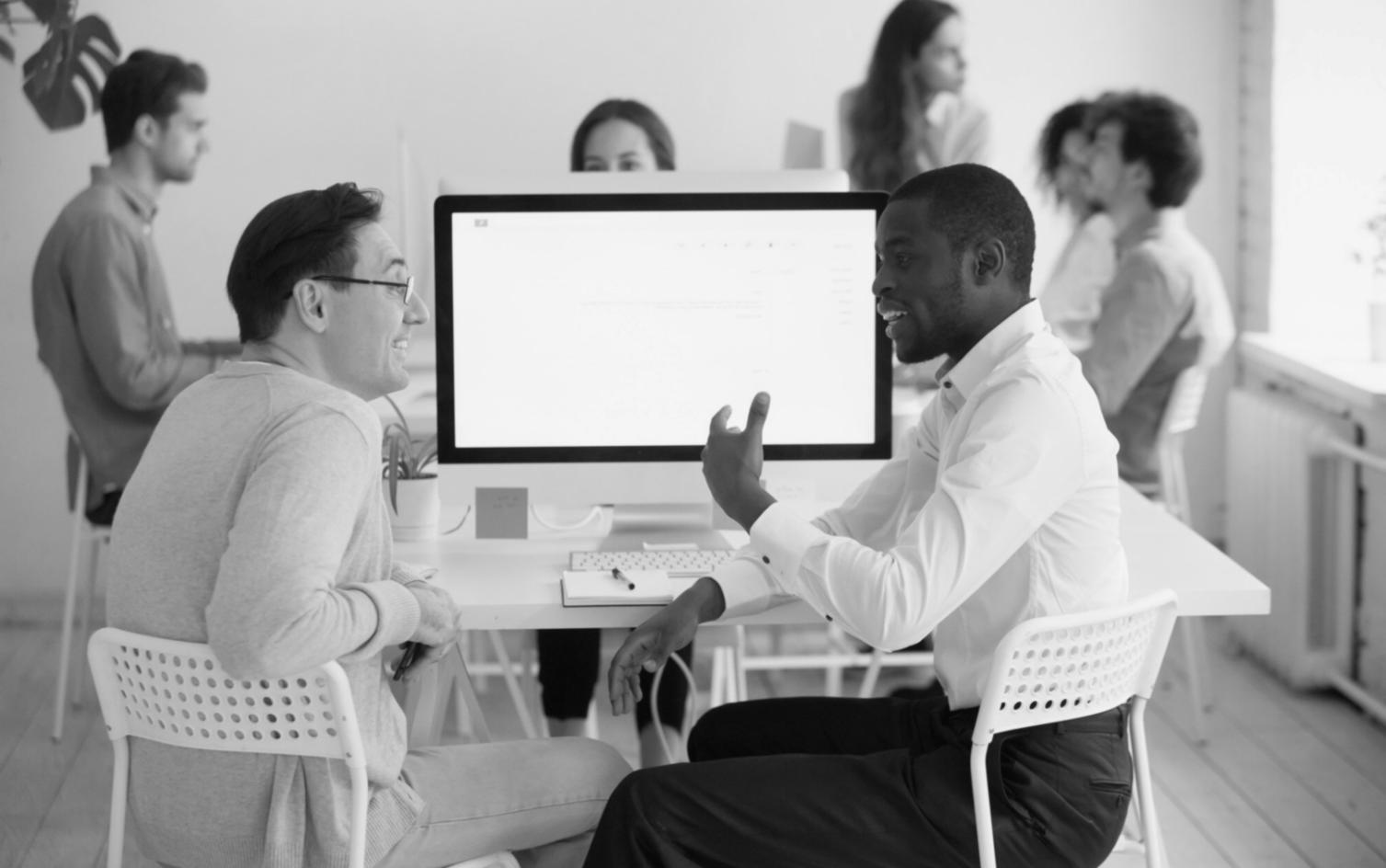 Financial analysis workspace showing business data and planning documents